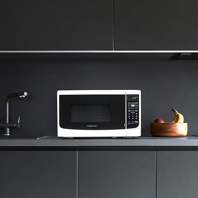 Farberware 0.7 Cu. Ft. Countertop Microwave Oven – 700 Watts Power, Auto Cook Settings, Defrost, Easy Clean and Child Safety Lock - White