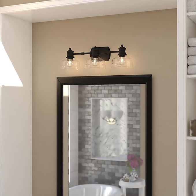 VAXCEL Beloit 3-Light 25.5 in. Wide Matte Black Farmhouse Bathroom Vanity Lighting Fixture, Clear Seeded Glass Shade, Dimmable, LED Compatible, Reversible Over The Mirror Mounted Steel Wall Sconce